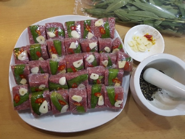 “Nem chua” (Northern dialect) or “nem” (Central and Southern dialect) is a Vietnamese fermented pork dish that uses pork, yeast of leaves and roasted rice powder for ripening, so has featured sour taste. 